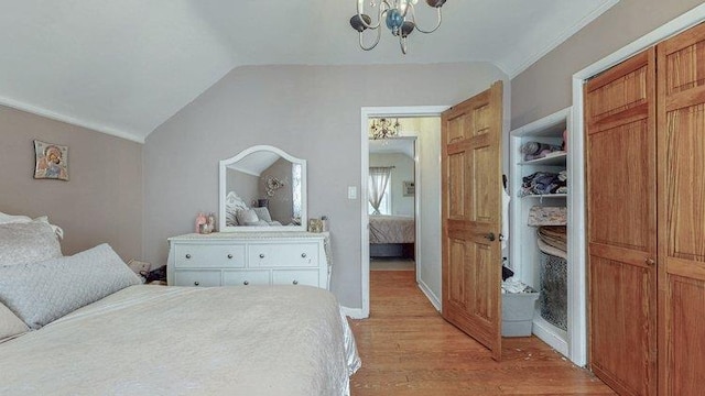 46-03 195th St, Flushing, NY 11358 - bedroom featuring light wood-type flooring, a chandelier, vaulted ceiling, and a closet