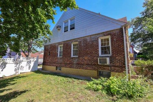 46-03 195th St, Flushing, NY 11358 - view of property exterior featuring brick siding