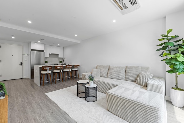 46-40 Vernon Blvd Unit 2A, Long Island City, NY 11101 - living area with light wood-style floors and recessed lighting