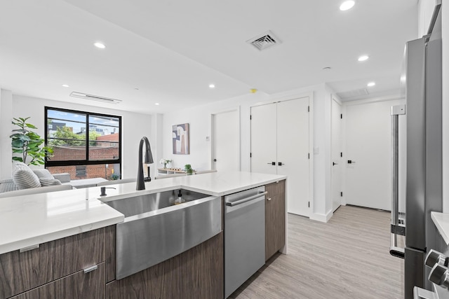 46-40 Vernon Blvd Unit 2A, Long Island City, NY 11101 - kitchen with stainless steel appliances, open floor plan, light wood-style flooring, recessed lighting, and modern cabinets
