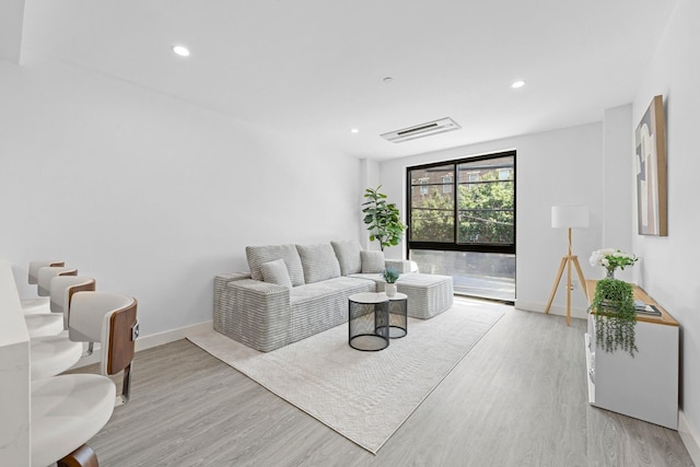 46-40 Vernon Blvd Unit 2A, Long Island City, NY 11101 - living area featuring wood finished floors and recessed lighting