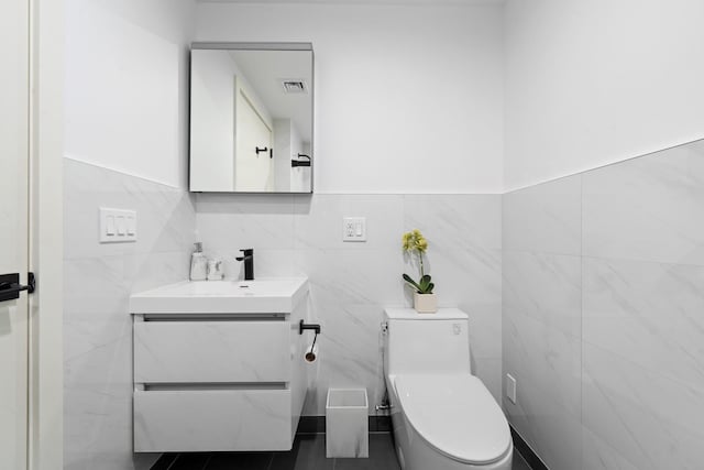 46-40 Vernon Blvd Unit 2A, Long Island City, NY 11101 - half bathroom featuring tile walls and vanity
