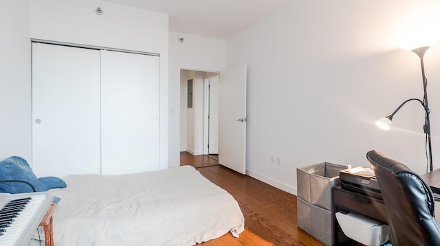 40-26 College Point Blvd Unit 15C, Flushing, NY 11354 - bedroom featuring wood finished floors, a closet, and electric panel
