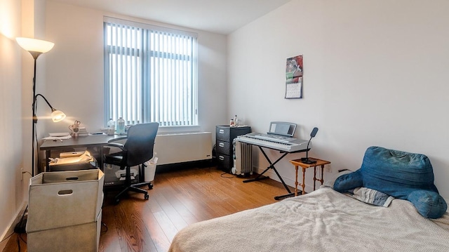 40-26 College Point Blvd Unit 15C, Flushing, NY 11354 - bedroom featuring wood finished floors and an office area