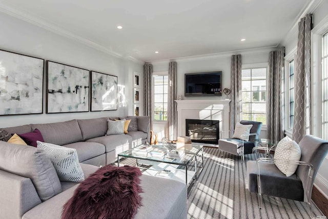 272 Crabapple Rd, Manhasset, NY 11030 - living room with plenty of natural light, ornamental molding, a glass covered fireplace, recessed lighting, and wood finished floors