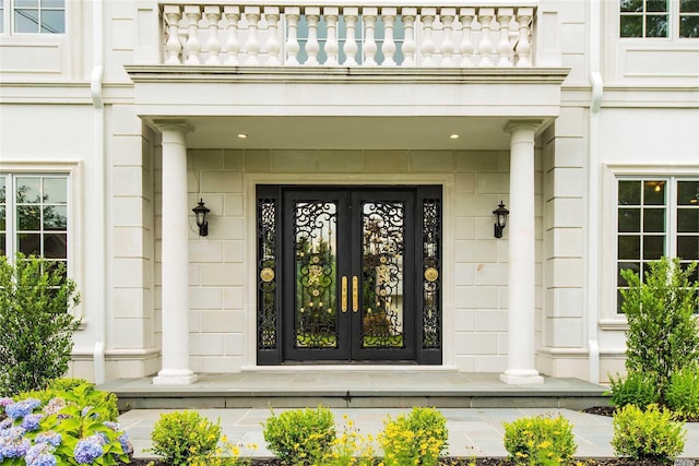 272 Crabapple Rd, Manhasset, NY 11030 - entrance to property featuring a balcony, french doors, and covered porch