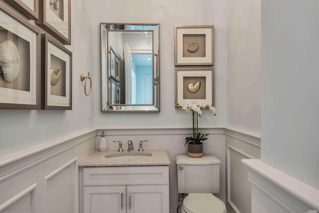 272 Crabapple Rd, Manhasset, NY 11030 - bathroom featuring vanity and a wainscoted wall