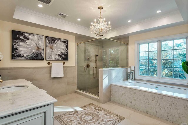 272 Crabapple Rd, Manhasset, NY 11030 - bathroom featuring a garden tub, crown molding, vanity, a chandelier, and a stall shower