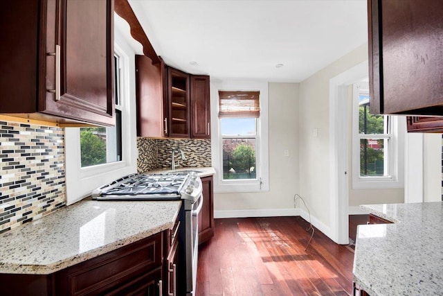 1519 Rosedale Ave, Bronx, NY 10460 - kitchen with stainless steel range with gas cooktop, dark wood-style flooring, light stone countertops, and decorative backsplash