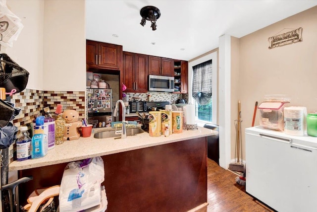 1519 Rosedale Ave, Bronx, NY 10460 - kitchen with fridge, a peninsula, tasteful backsplash, stainless steel microwave, and dark wood-style flooring