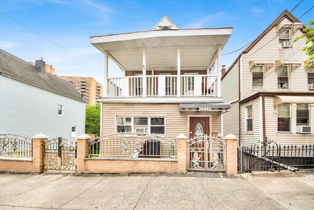 1519 Rosedale Ave, Bronx, NY 10460 - view of front facade featuring a balcony, a gate, and a fenced front yard