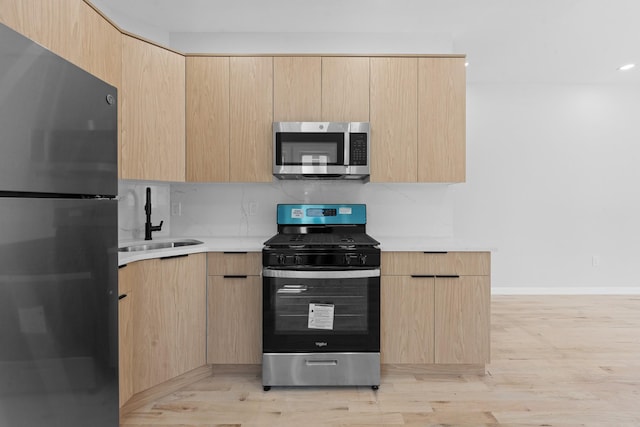 1276 E 59th St, Brooklyn, NY 11234 - kitchen with stainless steel appliances and light brown cabinetry