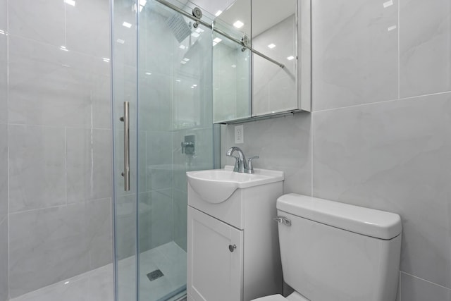 1276 E 59th St, Brooklyn, NY 11234 - bathroom featuring tile walls, a stall shower, and vanity
