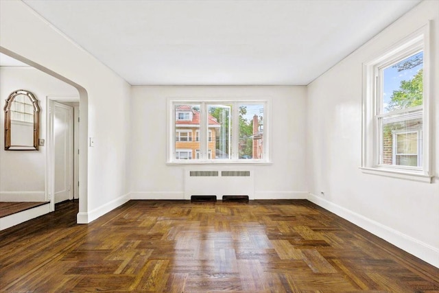6112 Fieldston Rd, Bronx, NY 10471 - spare room featuring radiator and arched walkways
