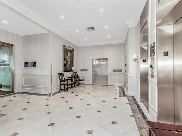 340 W 57th St Unit 5F, New York Manhattan, NY 10019 - building lobby with ornamental molding, recessed lighting, a decorative wall, and wallpapered walls