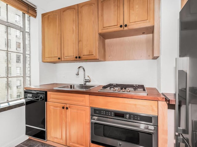 340 W 57th St Unit 5F, New York Manhattan, NY 10019 - kitchen featuring appliances with stainless steel finishes and dark countertops