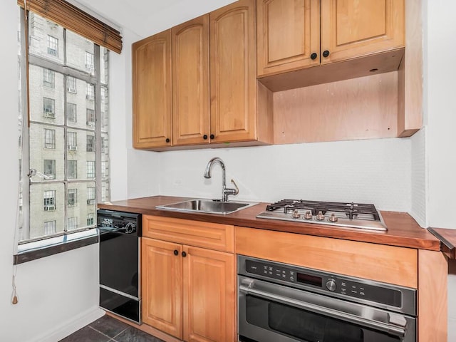 340 W 57th St Unit 5F, New York Manhattan, NY 10019 - kitchen with appliances with stainless steel finishes, dark countertops, and dark tile patterned floors