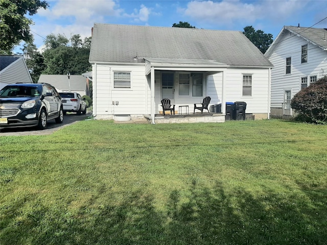 52 Fountain Pl, Poughkeepsie, NY 12603 - rear view of property featuring a lawn and covered porch
