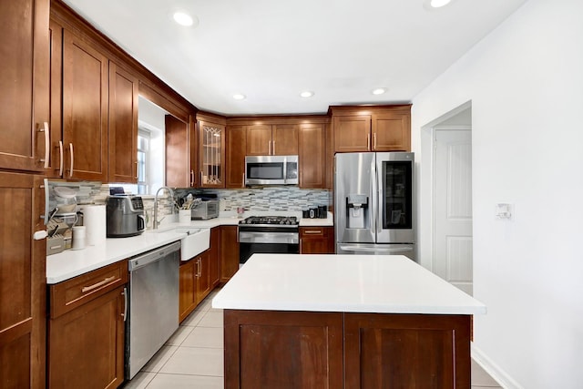 946 Balcom Ave, Bronx, NY 10465 - kitchen with stainless steel appliances, tasteful backsplash, recessed lighting, a kitchen island, and glass insert cabinets