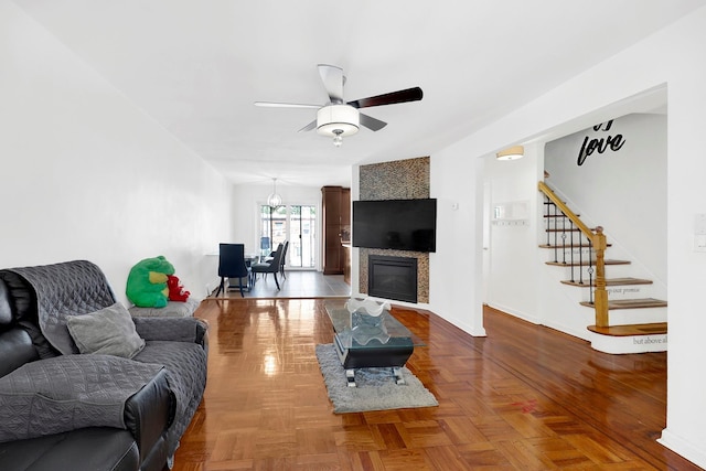 946 Balcom Ave, Bronx, NY 10465 - living room featuring ceiling fan, stairway, and a fireplace