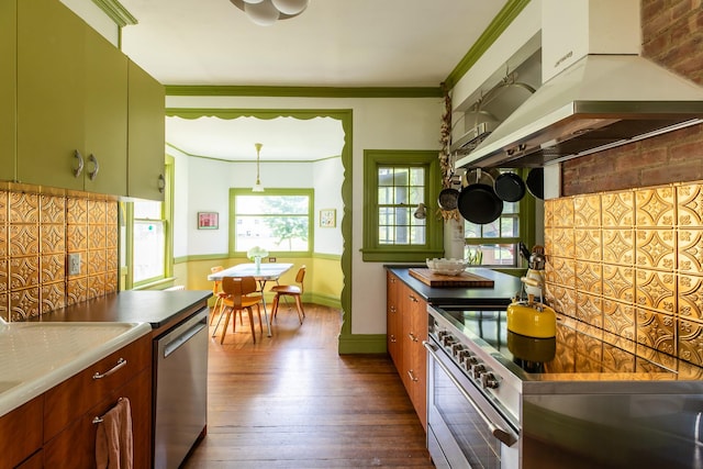 7432 S Broadway, Red Hook, NY 12571 - kitchen with range hood, appliances with stainless steel finishes, dark wood-style flooring, and crown molding