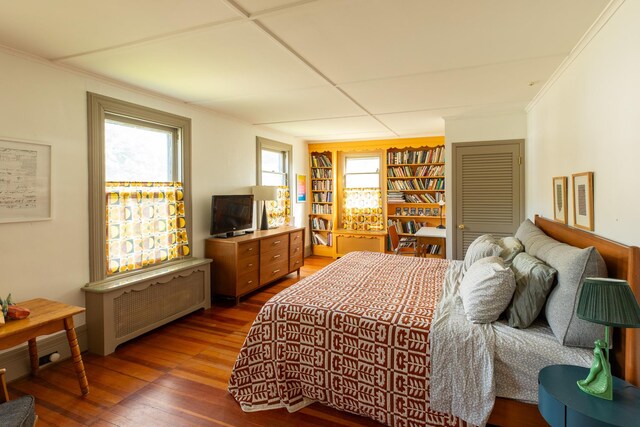 7432 S Broadway, Red Hook, NY 12571 - bedroom with wood finished floors, radiator, and crown molding