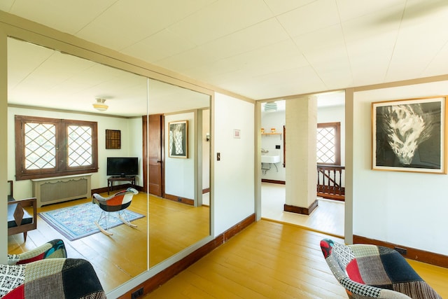 7432 S Broadway, Red Hook, NY 12571 - living area with radiator and hardwood / wood-style floors