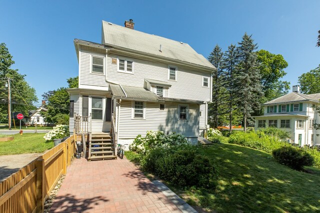 7432 S Broadway, Red Hook, NY 12571 - back of house featuring a chimney and roof with shingles