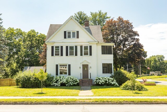 7432 S Broadway, Red Hook, NY 12571 - view of front of property with a chimney and a front lawn