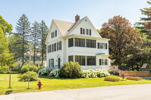 7432 S Broadway, Red Hook, NY 12571 - view of home's exterior featuring a chimney and a lawn