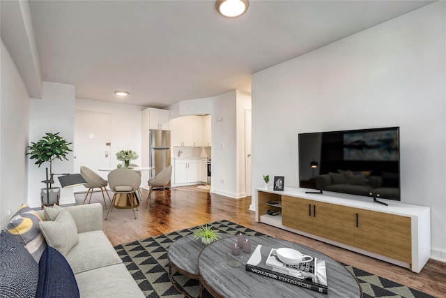 50-22 40th St Unit 2F, Sunnyside, NY 11104 - living area with dark wood finished floors and baseboards