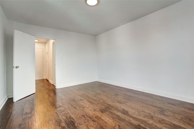 50-22 40th St Unit 2F, Sunnyside, NY 11104 - unfurnished room with dark wood-style flooring and baseboards
