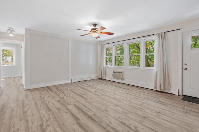 68 Gerald Dr Unit D1, Poughkeepsie, NY 12601 - foyer entrance with a wall mounted air conditioner, ceiling fan, light wood-style flooring, and a baseboard heating unit