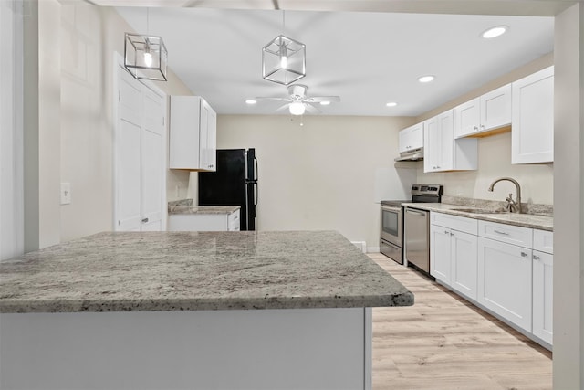68 Gerald Dr Unit D1, Poughkeepsie, NY 12601 - kitchen with stainless steel appliances, white cabinets, light wood finished floors, and recessed lighting