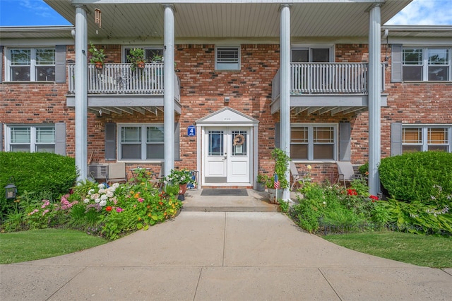 54 Fairharbor Dr Unit 54, Patchogue, NY 11772 - doorway to property with brick siding