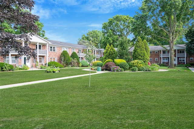 54 Fairharbor Dr Unit 54, Patchogue, NY 11772 - surrounding community with a yard and a residential view
