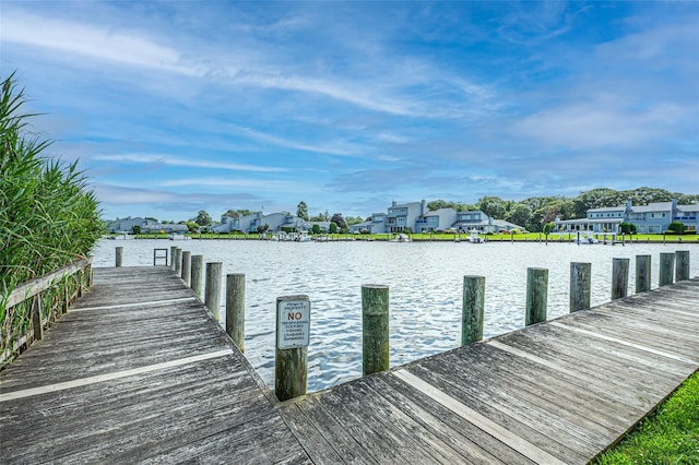 54 Fairharbor Dr Unit 54, Patchogue, NY 11772 - dock area featuring a water view and a residential view