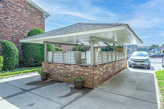 54 Fairharbor Dr Unit 54, Patchogue, NY 11772 - view of patio / terrace featuring mail area