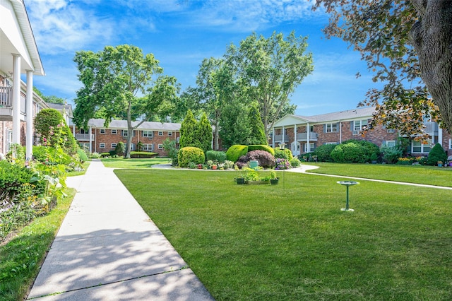 54 Fairharbor Dr Unit 54, Patchogue, NY 11772 - view of property's community with a lawn and a residential view