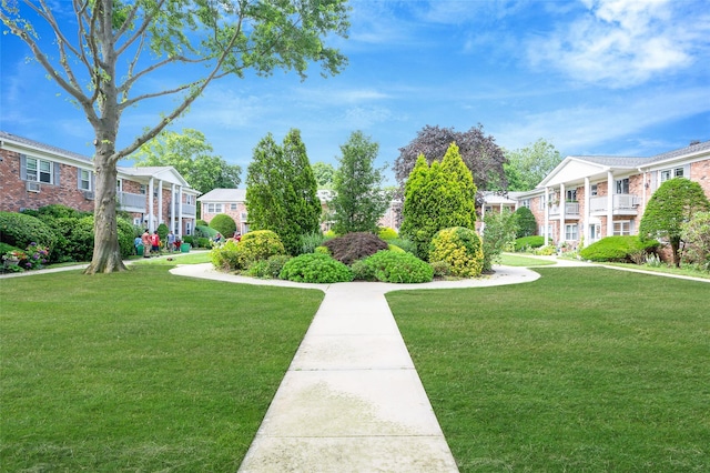 54 Fairharbor Dr Unit 54, Patchogue, NY 11772 - view of property's community featuring a lawn