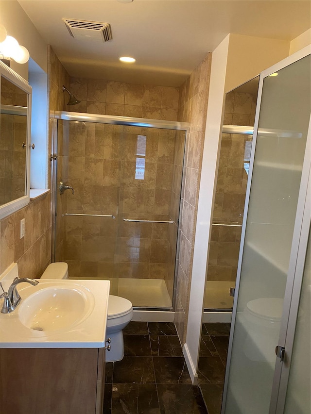 3138 137th St Unit 9B, Flushing, NY 11354 - bathroom with vanity, a shower stall, tile walls, and recessed lighting