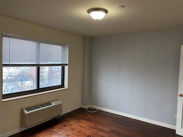 3138 137th St Unit 9B, Flushing, NY 11354 - unfurnished room featuring dark wood-style flooring and a wall mounted air conditioner