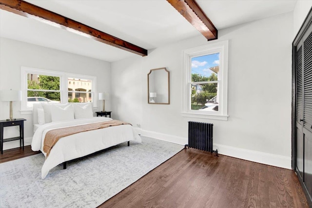 4 Cedar St, Hastings-On-Hudson, NY 10706 - bedroom featuring radiator, beam ceiling, dark wood finished floors, multiple windows, and a closet