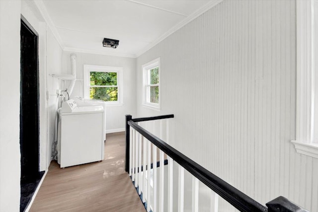 4 Cedar St, Hastings-On-Hudson, NY 10706 - corridor featuring washing machine and clothes dryer, an upstairs landing, light wood-style floors, and crown molding