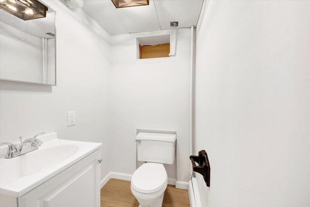 4 Cedar St, Hastings-On-Hudson, NY 10706 - half bath featuring vanity and wood finished floors