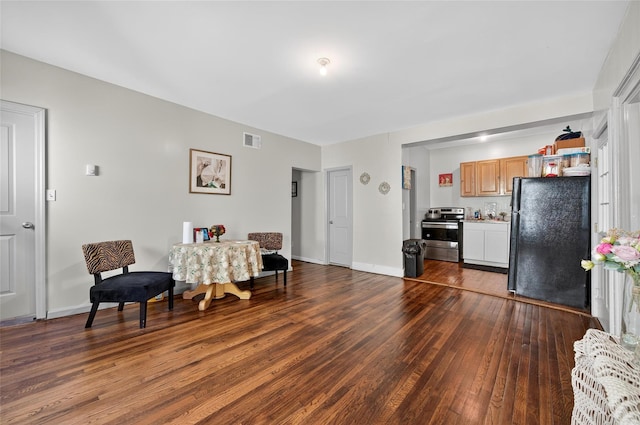 33 E Main St, Blooming Grove, NY 10992 - living area featuring dark wood-style floors and baseboards