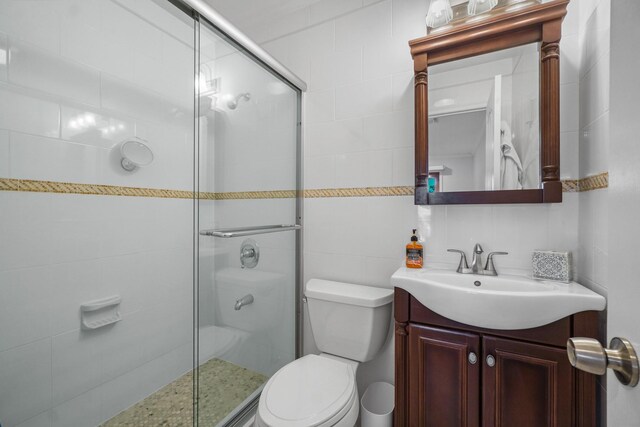 4048 194th St Unit A3, Flushing, NY 11358 - full bathroom with vanity, a stall shower, and tile walls