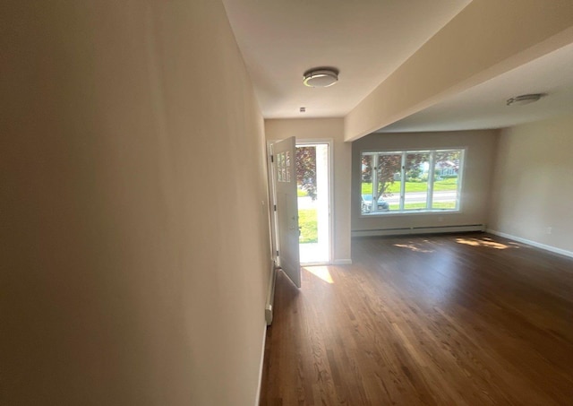 181 Wading River Hollow Rd, Ridge, NY 11961 - spare room featuring wood finished floors and a baseboard heating unit