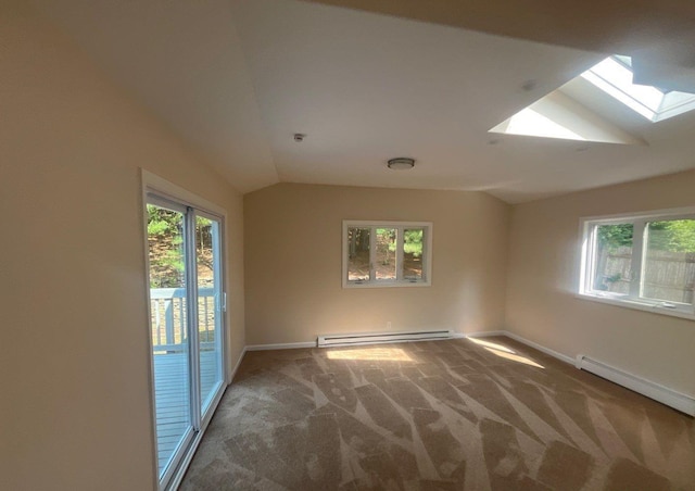 181 Wading River Hollow Rd, Ridge, NY 11961 - unfurnished room featuring a skylight, baseboard heating, carpet flooring, vaulted ceiling, and plenty of natural light