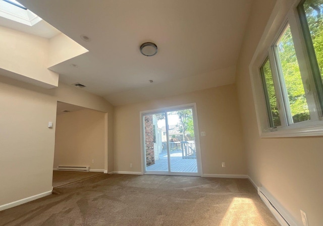 181 Wading River Hollow Rd, Ridge, NY 11961 - unfurnished room with baseboard heating, carpet flooring, and a skylight